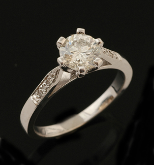 Appraisal: A diamond solitaire ring The round brilliant cut diamond weighing