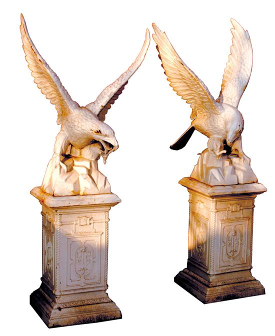 Appraisal: Pair painted cast-iron eagles on pedestals out-stretched winged birds of