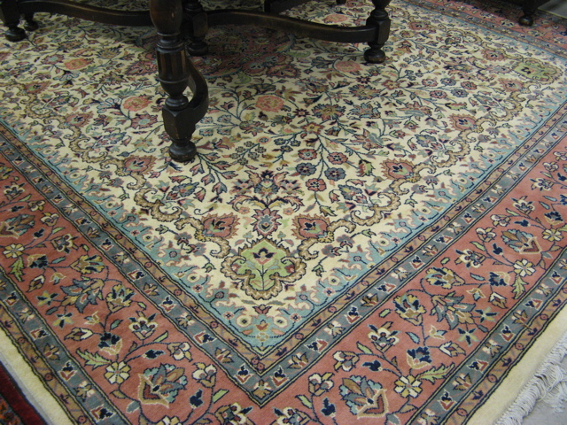 Appraisal: HAND KNOTTED ORIENTAL CARPET Pakistani Persian floral and central floral