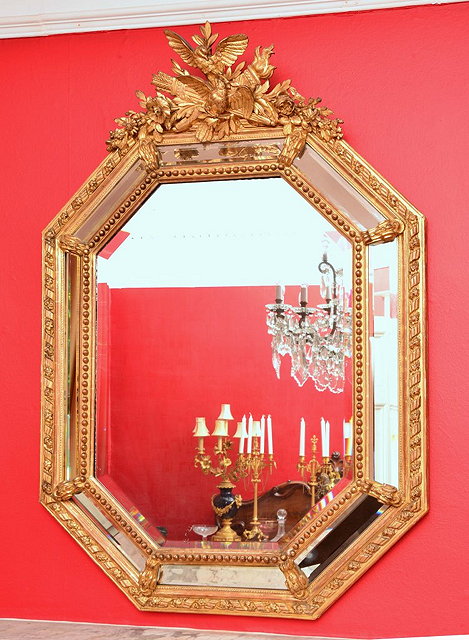 Appraisal: A TH CENTURY GILTWOOD AND PLASTER MIRROR with cushion frame