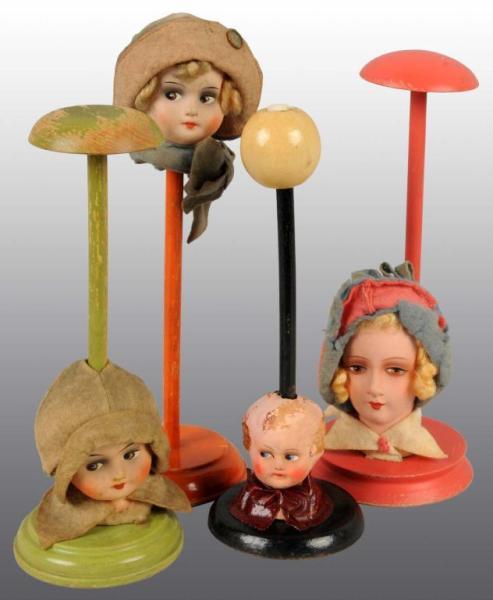 Appraisal: Lot of Hat Stands Description Germany Ca Papier-mach faces painted