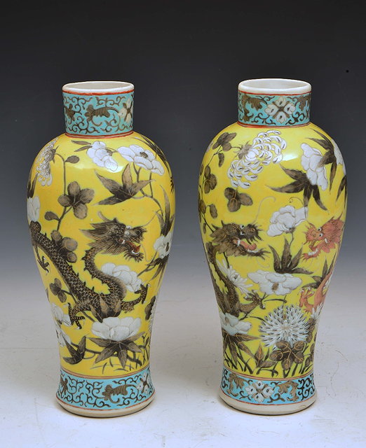 Appraisal: A PAIR OF CHINESE CANTON YELLOW GROUND BALUSTER VASES each