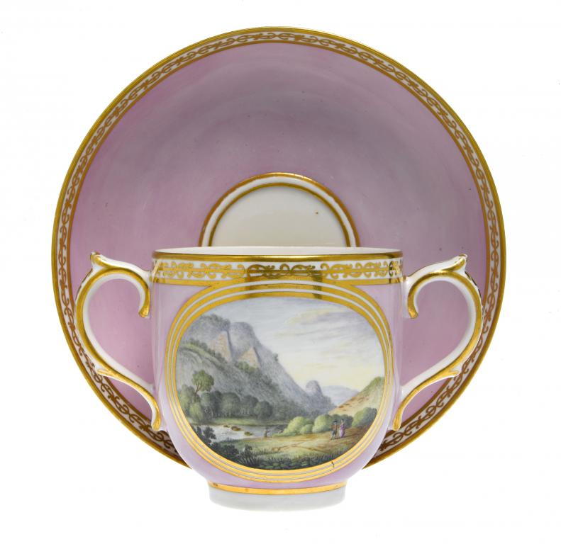 Appraisal: A DERBY TWO HANDLED CUP AND SAUCER the cup painted