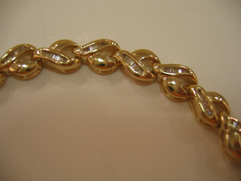 Appraisal: DIAMOND BRACELET k yellow gold polished link bracelet set with