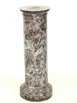 Appraisal: A variegated marble pedestal with circular moulded top above column