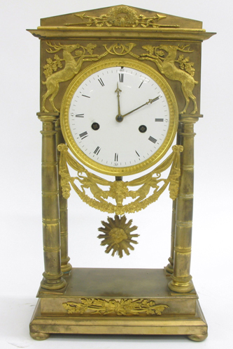 Appraisal: EMPIRE ORMOLU PORTICO CLOCK French early th century the round