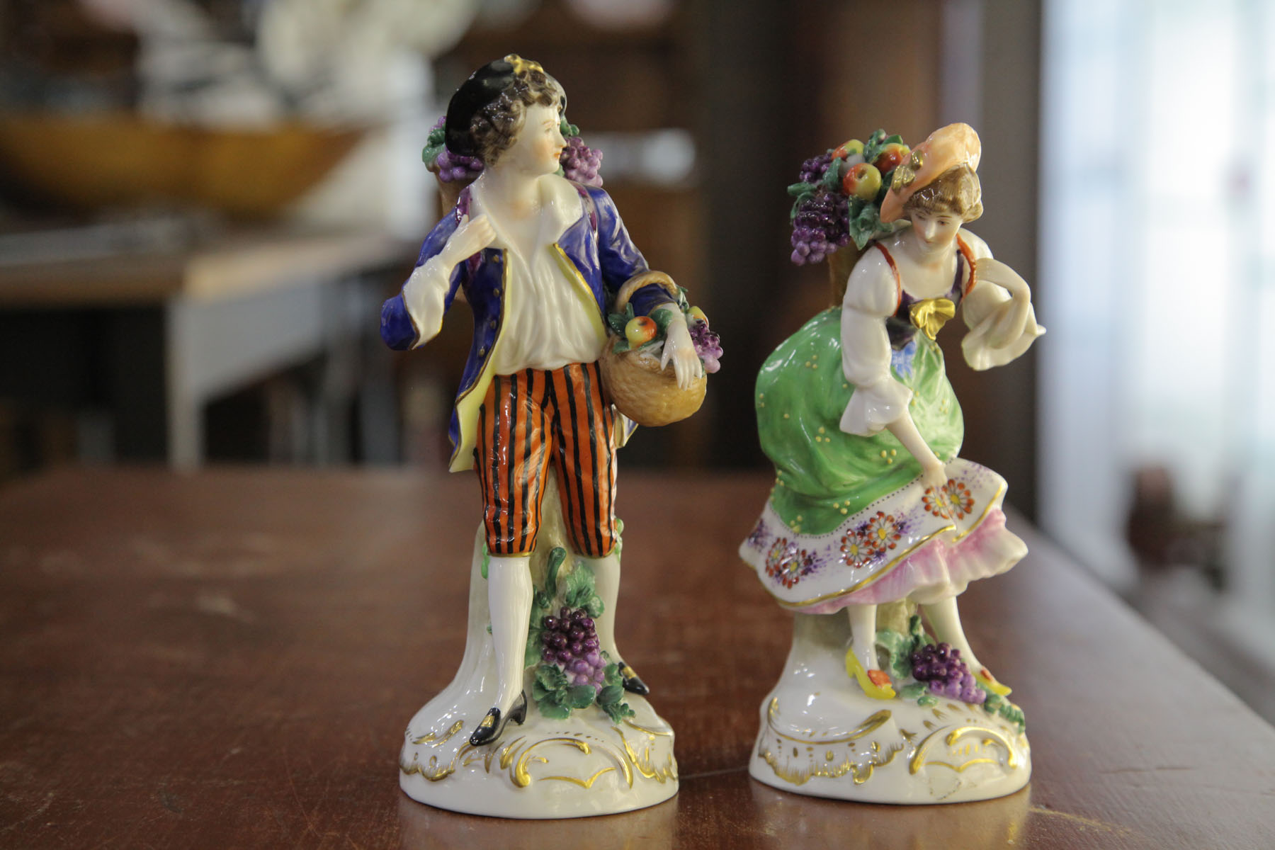 Appraisal: PAIR OF PORCELAIN FIGURES Germany th century Man and woman