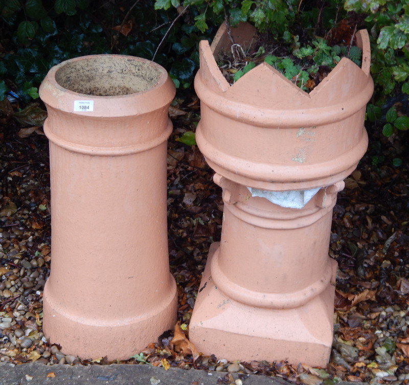 Appraisal: Two terracotta chimney pots one with a crinolated top