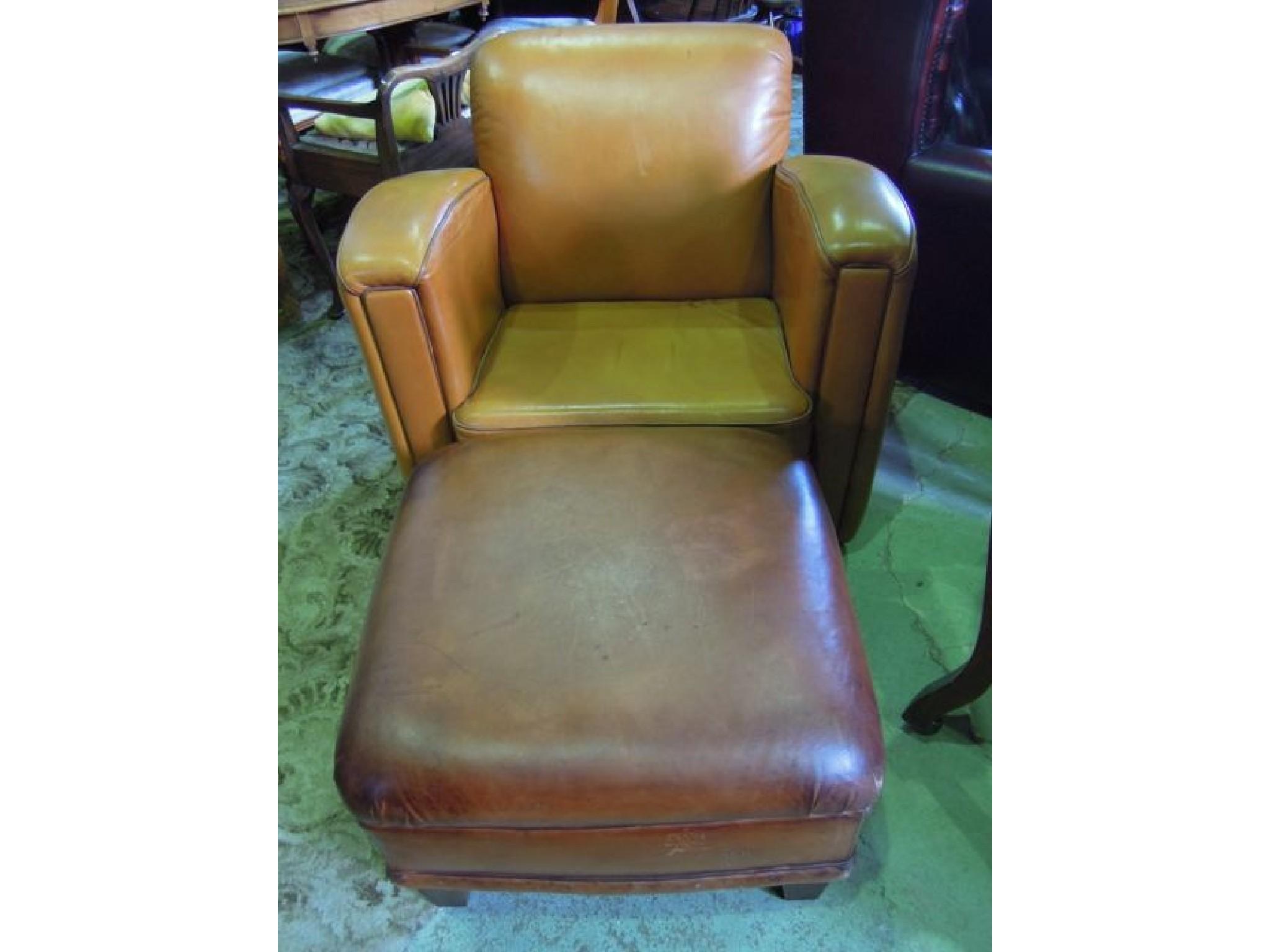 Appraisal: An Art Deco style tan leather upholstered club chair with