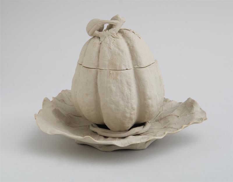 Appraisal: CONTINENTAL UNGLAZED POTTERY PUMPKIN-FORM SAUCE TUREEN AND ATTACHED STAND Relief