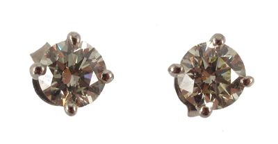 Appraisal: A pair of diamond stud earrings The circular cut diamond