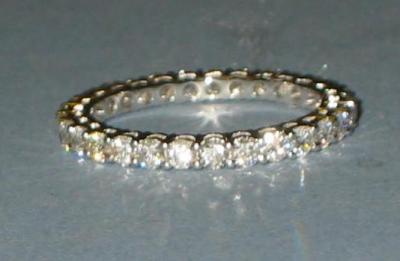 Appraisal: A DIAMOND FULL HOOP ETERNITY RING with thirty brilliant cut