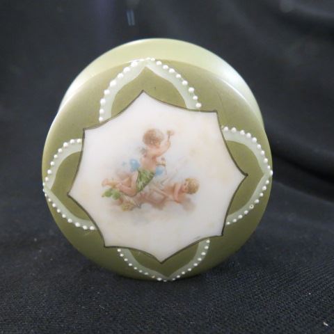 Appraisal: Nakara Art Glass Dresser Box cherubs satin green field diameter