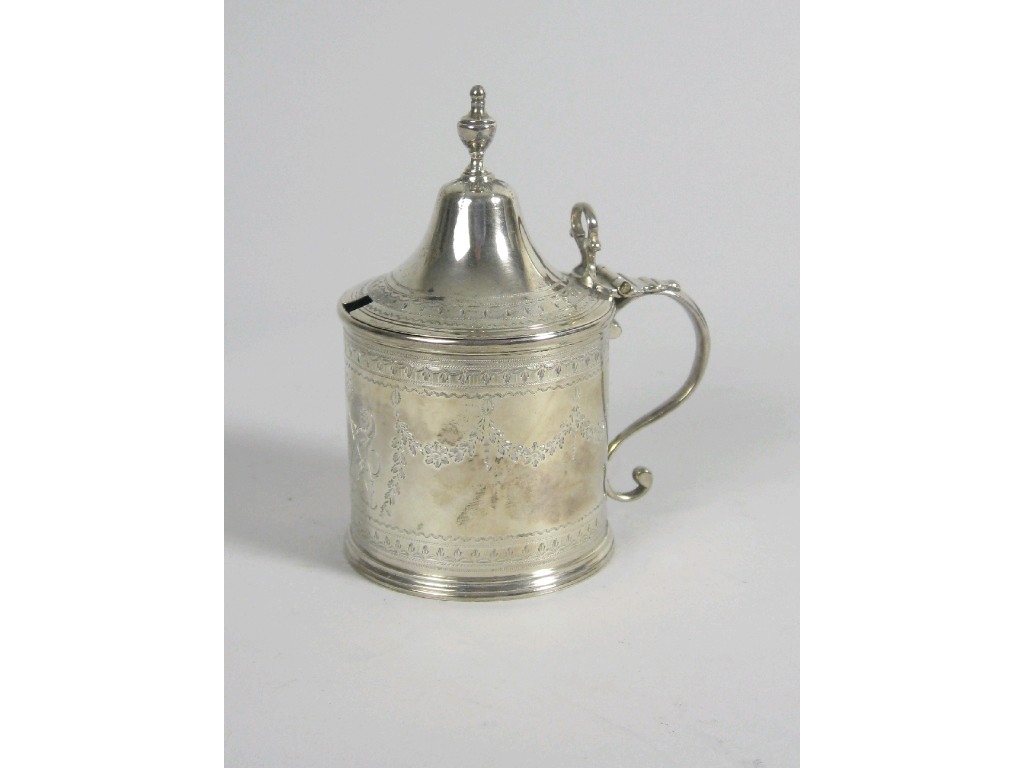 Appraisal: A George III Mustard Pot with finely engraved floral swags