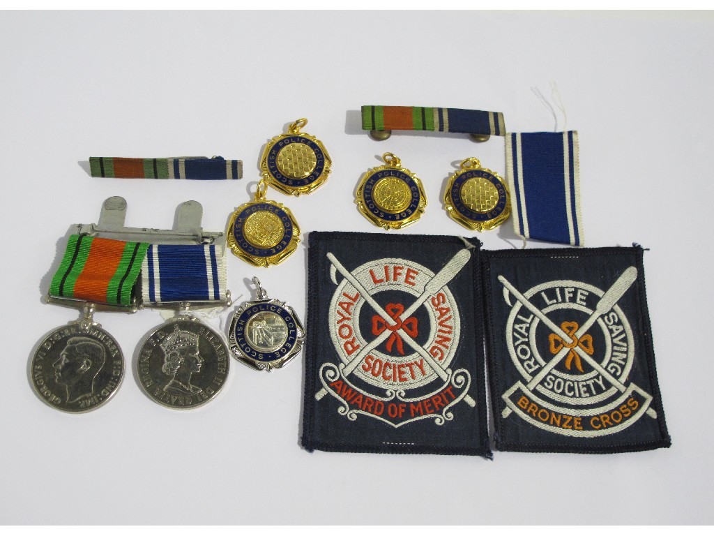 Appraisal: Lot comprising a Police Service Medal and a Defence Medal