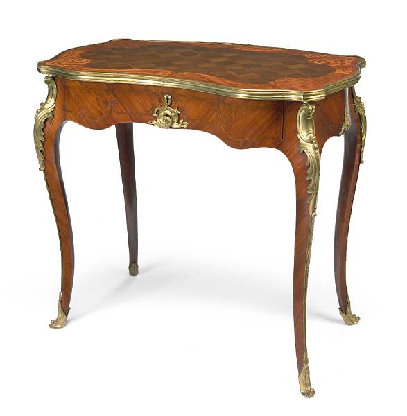 Appraisal: A Louis XV style gilt bronze mounted inlaid walnut table