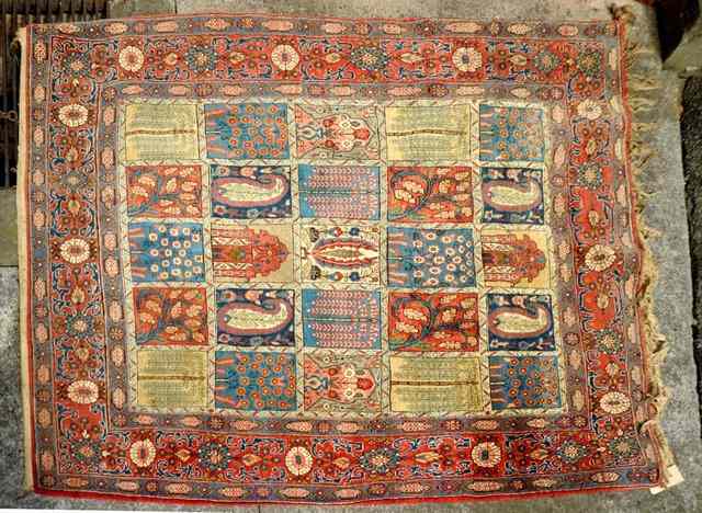 Appraisal: A PERSIAN PROBABLY KASHAN RUG with central panels of leaf