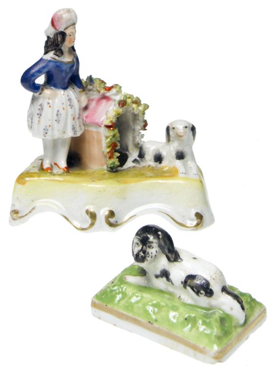 Appraisal: A STAFFORDSHIRE EARTHENWARE MINIATURE GROUP OF A GIRL AND SPANIEL