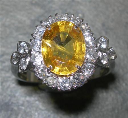 Appraisal: A contemporary ct white gold mounted yellow sapphire and diamond