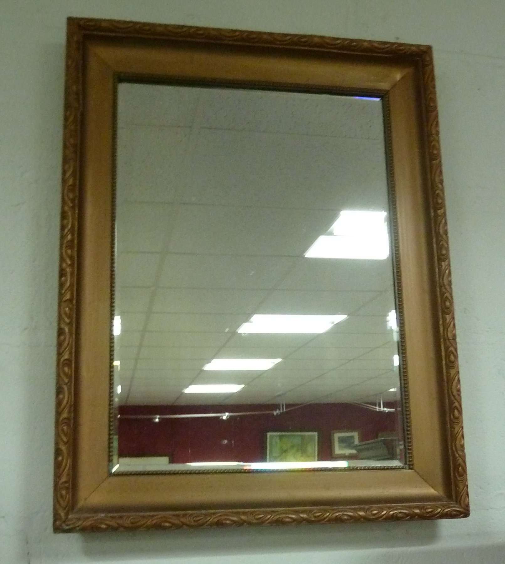 Appraisal: A rectangular wall mirror in a gilt frame cm x