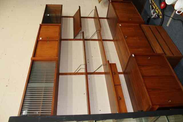 Appraisal: A QUANTITY OF CONTEMPORARY POSSIBLY DANISH TEAK WALL MOUNTED MODULAR