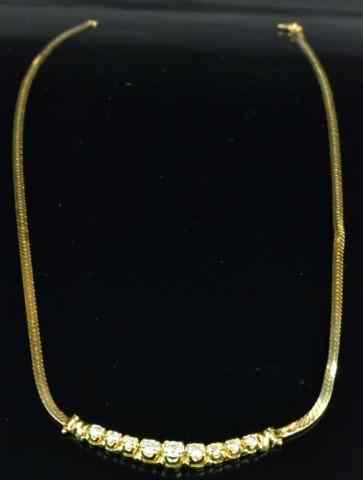 Appraisal: K Gold And Diamond NecklaceHaving a curved bar pendant containing