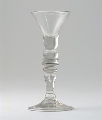 Appraisal: A gin glass the trumpet-shaped bowl above a teardrop and