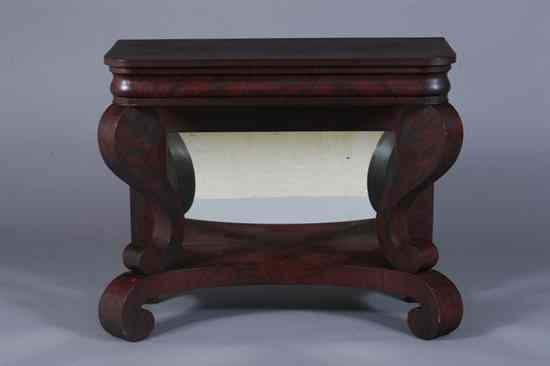 Appraisal: AMERICAN EMPIRE CARVED MAHOGANY CONSOLE TABLE Rectangular top with rounded