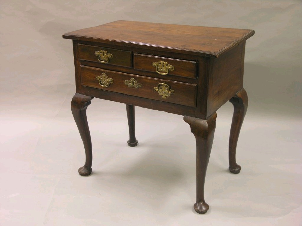 Appraisal: A George III fruitwood side table with one long and