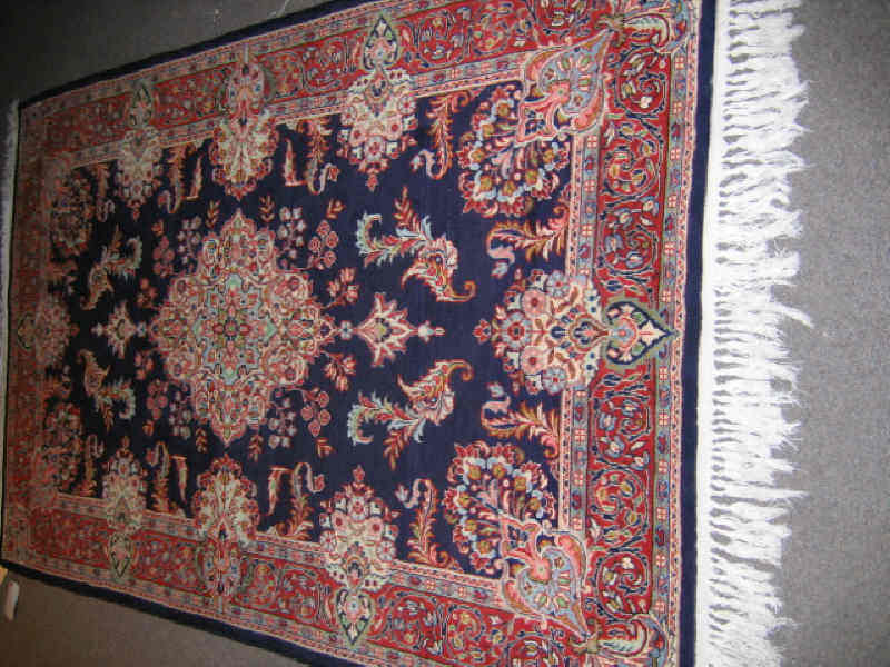 Appraisal: SAROUK AREA RUG The indigo field of scattered floral bouquets