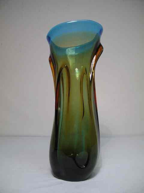 Appraisal: Hand blown glass vase with a blend of olive green