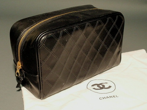 Appraisal: Chanel black quilted leather vanity bag with quilted logo and