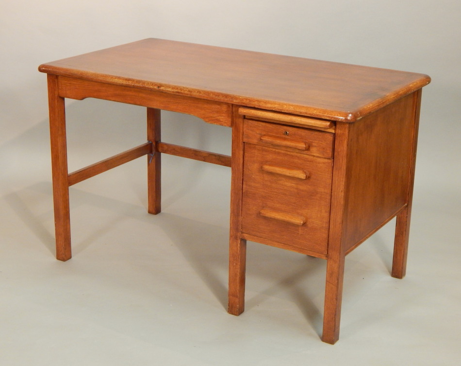 Appraisal: An early thC oak desk the top with a moulded