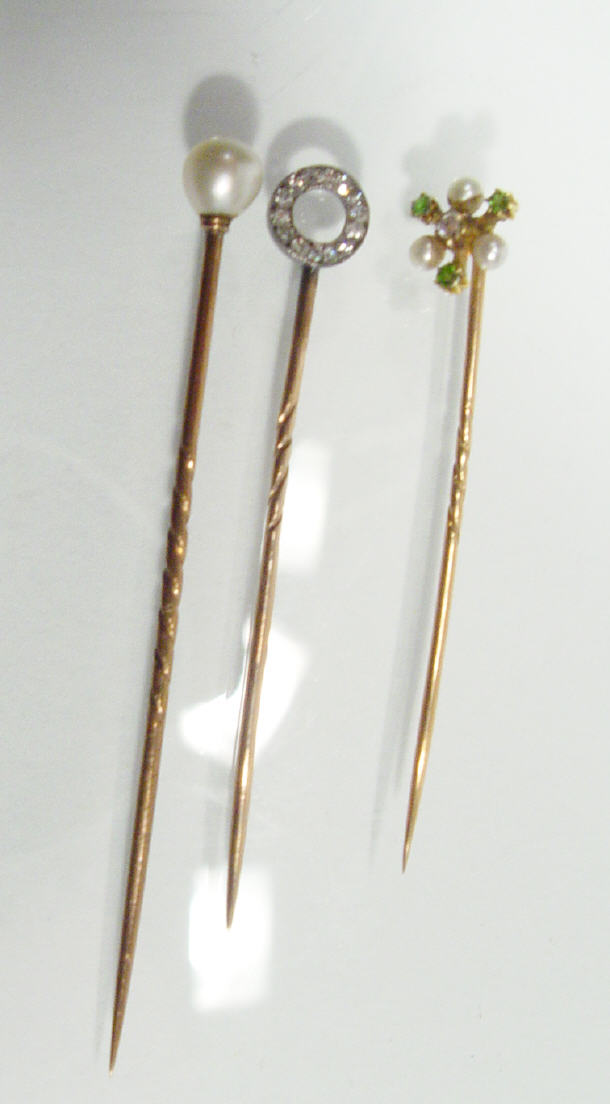 Appraisal: ct gold circular diamond stickpin diamond emerald and pearl stickpin