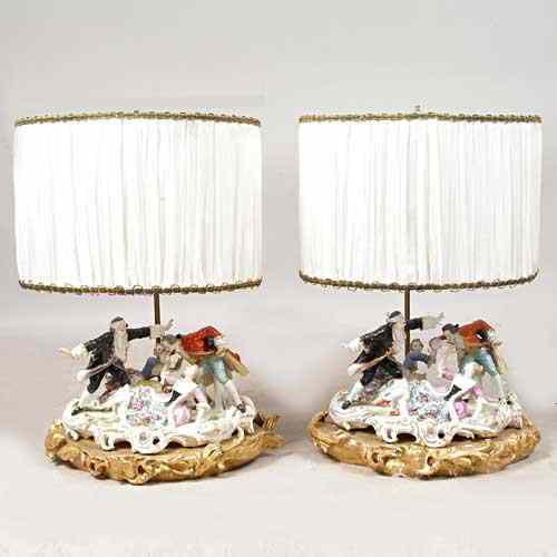 Appraisal: A Pair of German Porcelain Figural Group Table Lamps circa