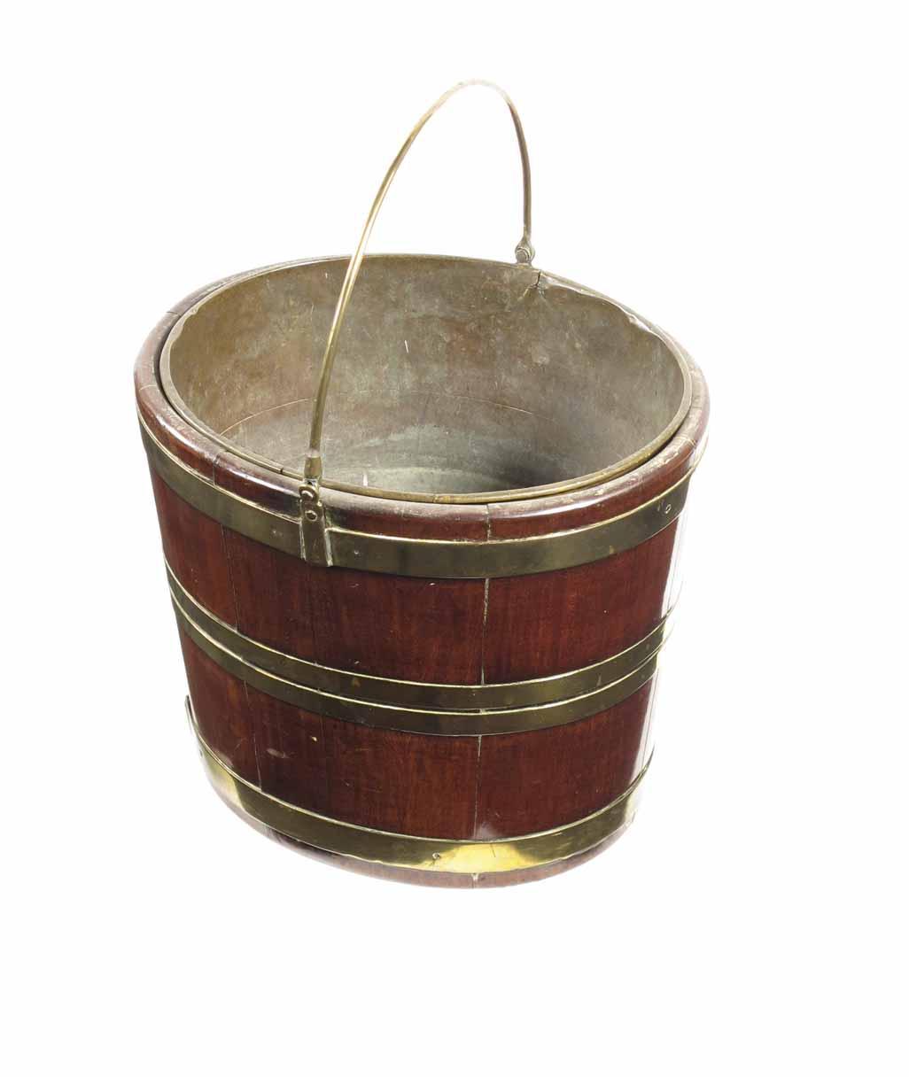 Appraisal: A th century mahogany and brass bound bucket