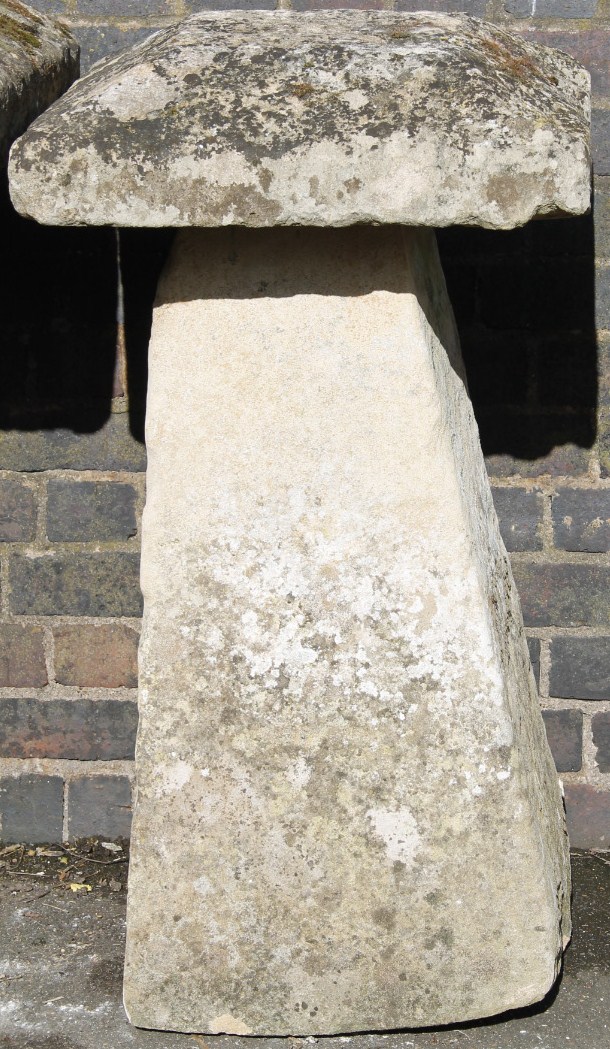 Appraisal: A staddle stone the shaped removable top on a tapering