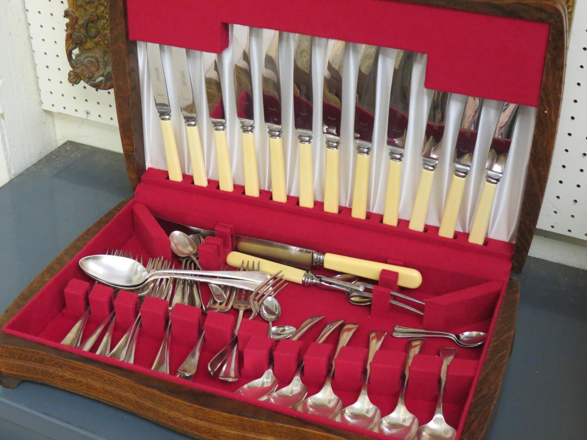 Appraisal: A Garrards canteen of silver plated cutlery includes Rustless knives