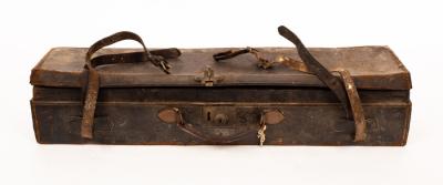 Appraisal: A leather double gun case with strap bearing a label