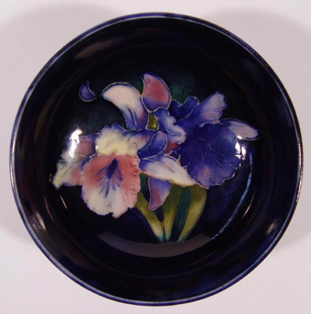 Appraisal: Moorcroft pottery bowl hand painted and tubelined with frilled orchids