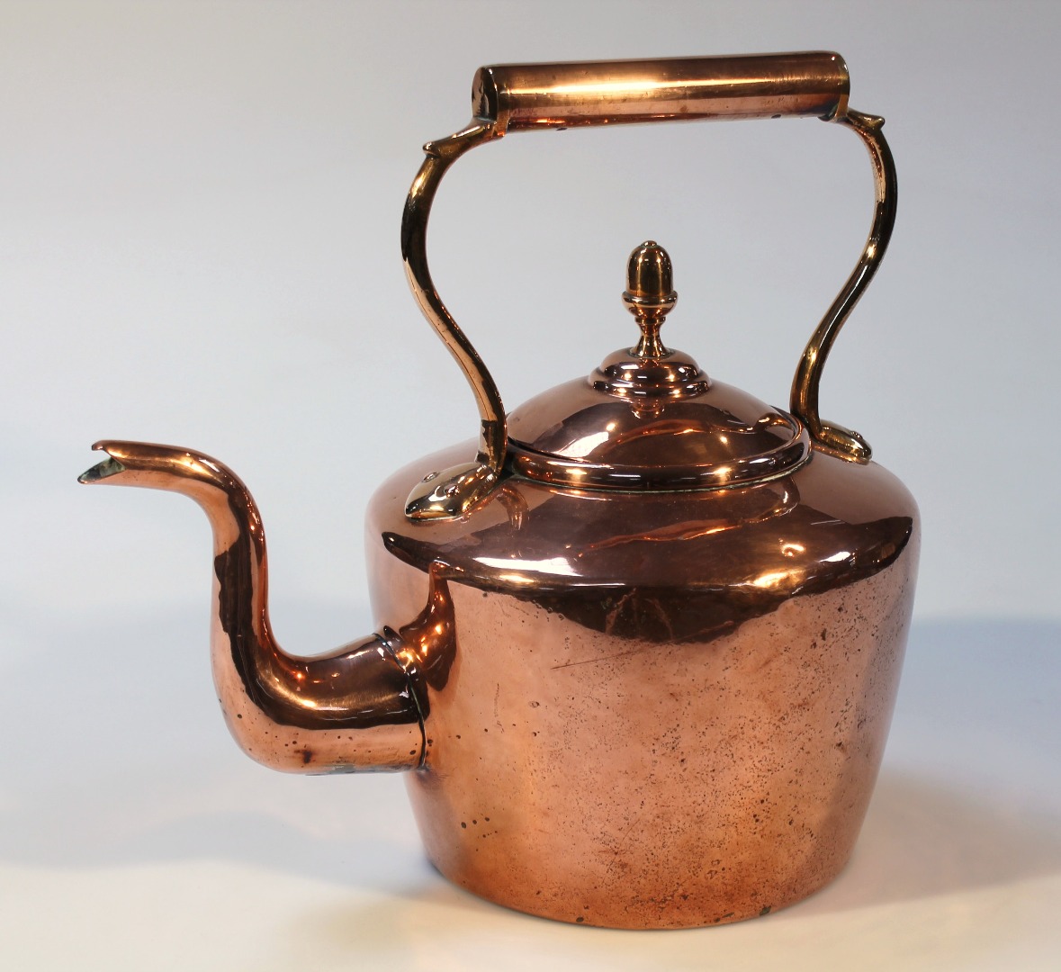 Appraisal: An early thC copper kettle with cylindrical handle the domed