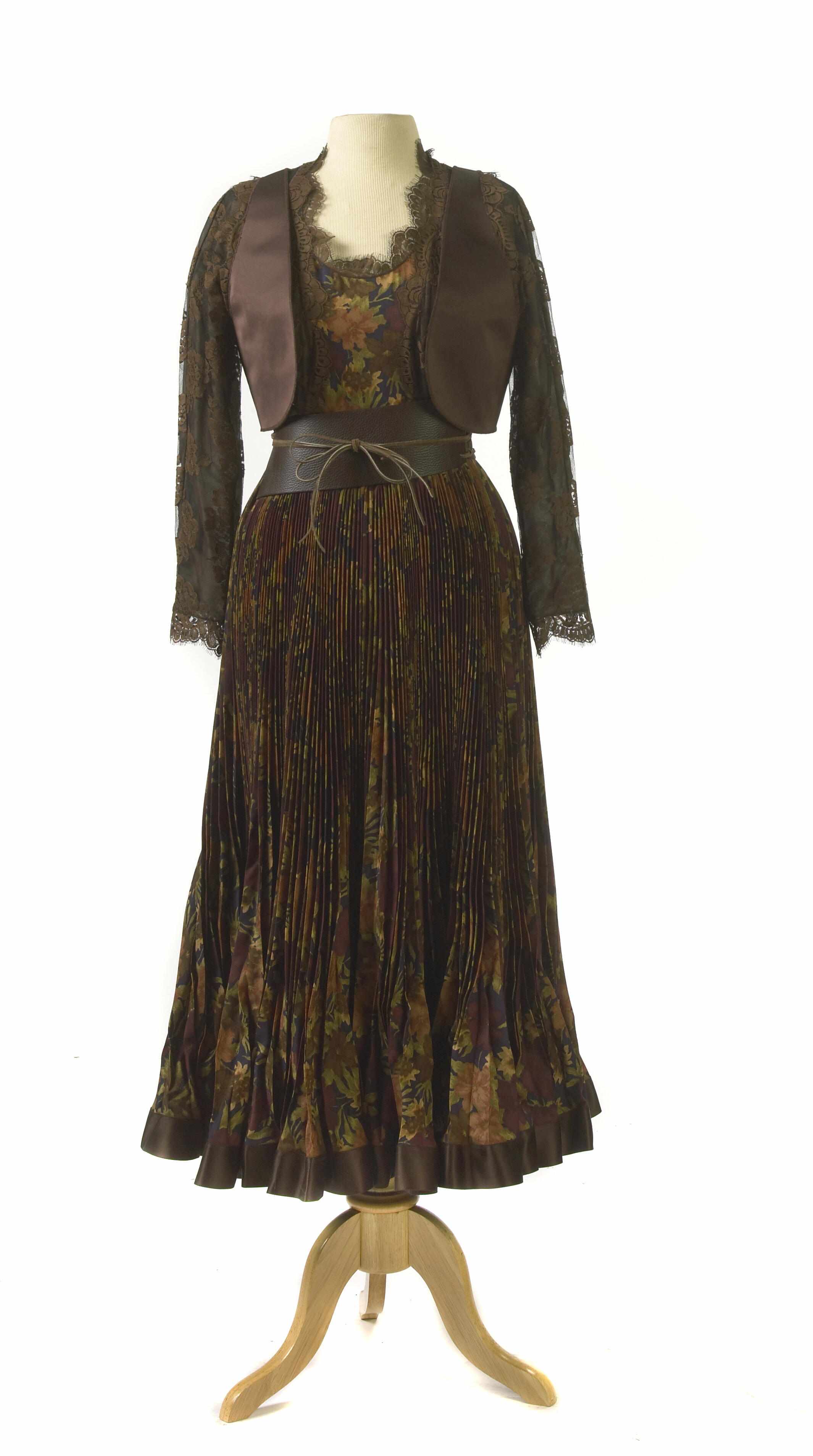 Appraisal: A Geoffrey Beene brown and black lace leather belted dress