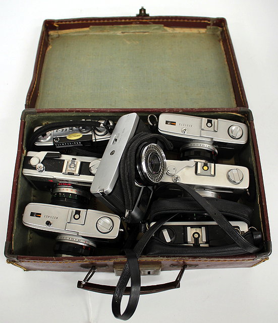 Appraisal: SEVEN VINTAGE CAMERAS to include three Olympus Trip cameras an