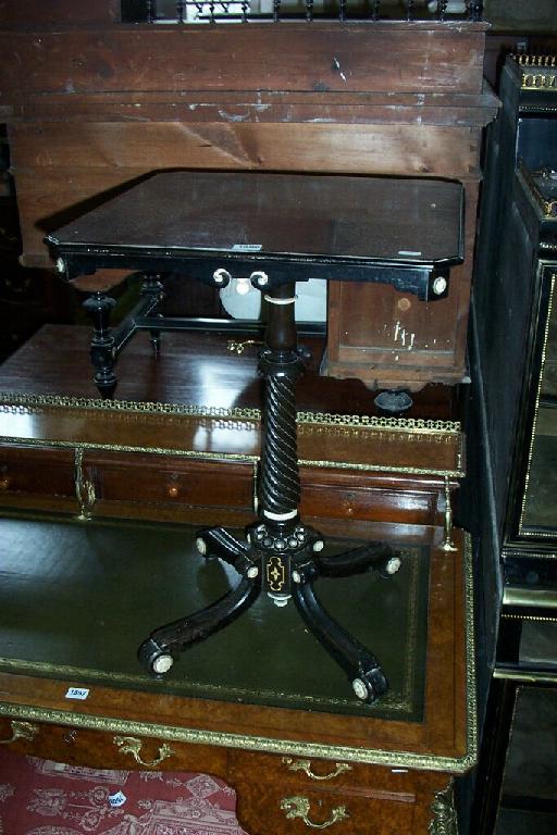 Appraisal: A th century ebonised occasional table the square cut top