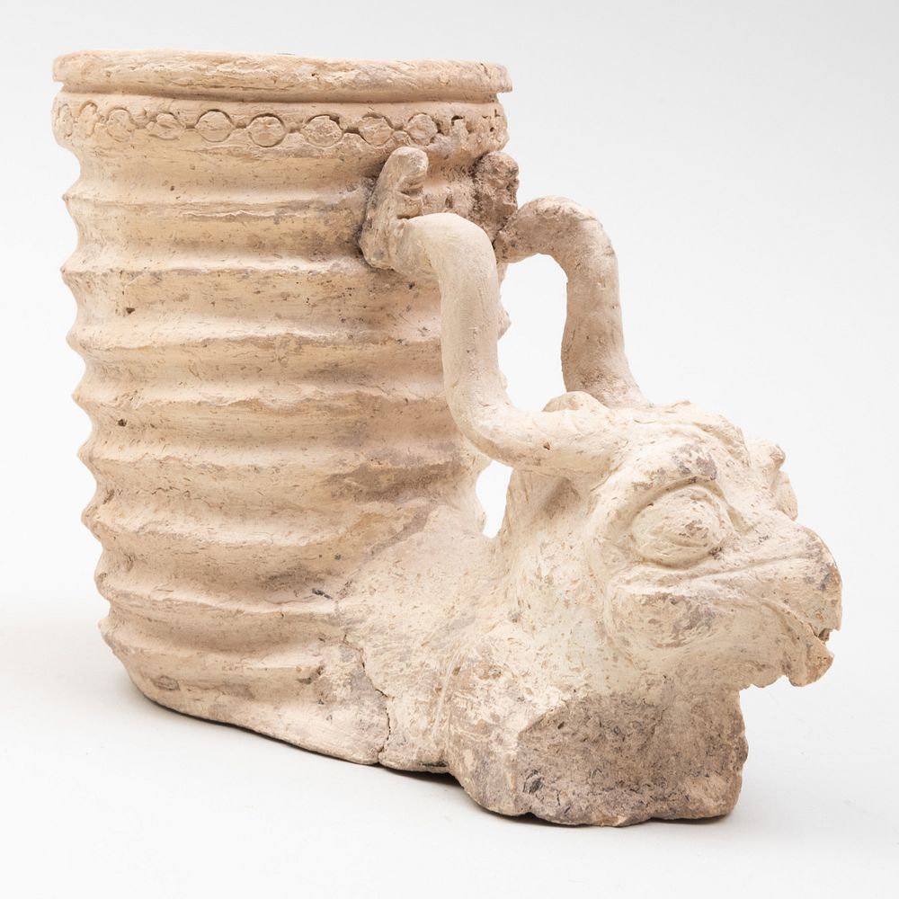 Appraisal: Persian Zoomorphic Pottery Rython with the Head of a Griffin