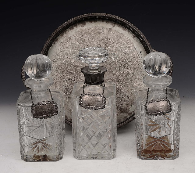 Appraisal: A GROUP OF THREE CUT GLASS SPIRIT DECANTERS one with