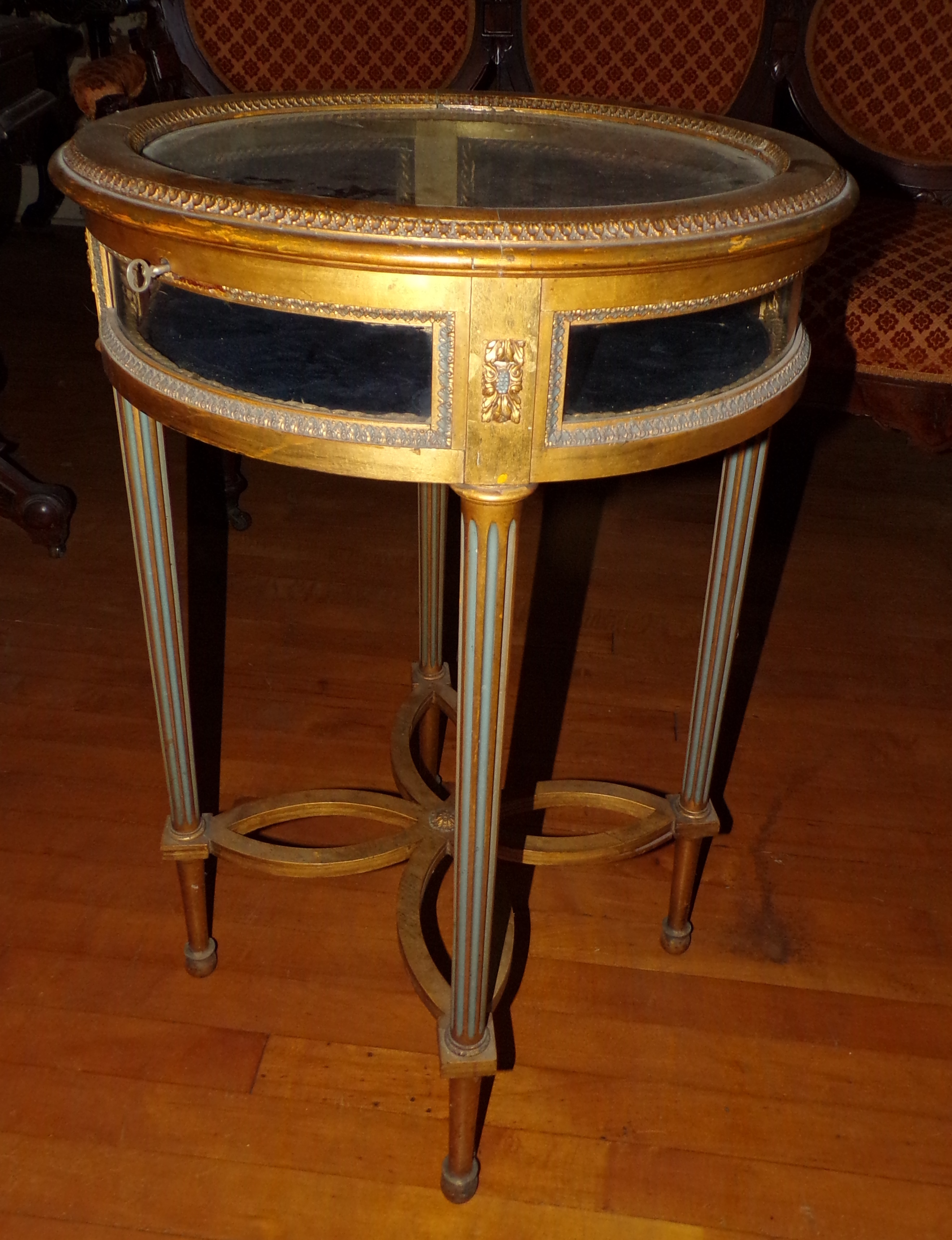 Appraisal: Gilt wood vitrine flip top reeded legs ''h '' dia