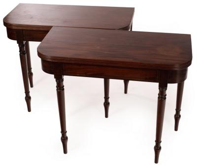 Appraisal: A pair of Regency mahogany fold-over card tables each with