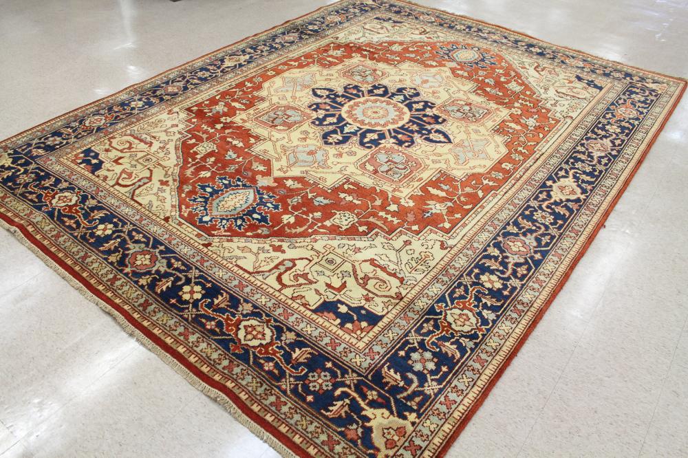 Appraisal: HAND KNOTTED ORIENTAL CARPET Indo-Serapi central medallion and stylized floral