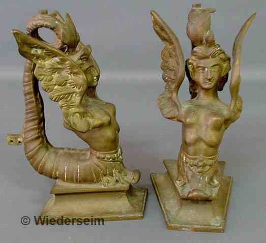 Appraisal: Pair of Victorian brass firedogs with winged grotesque figures As